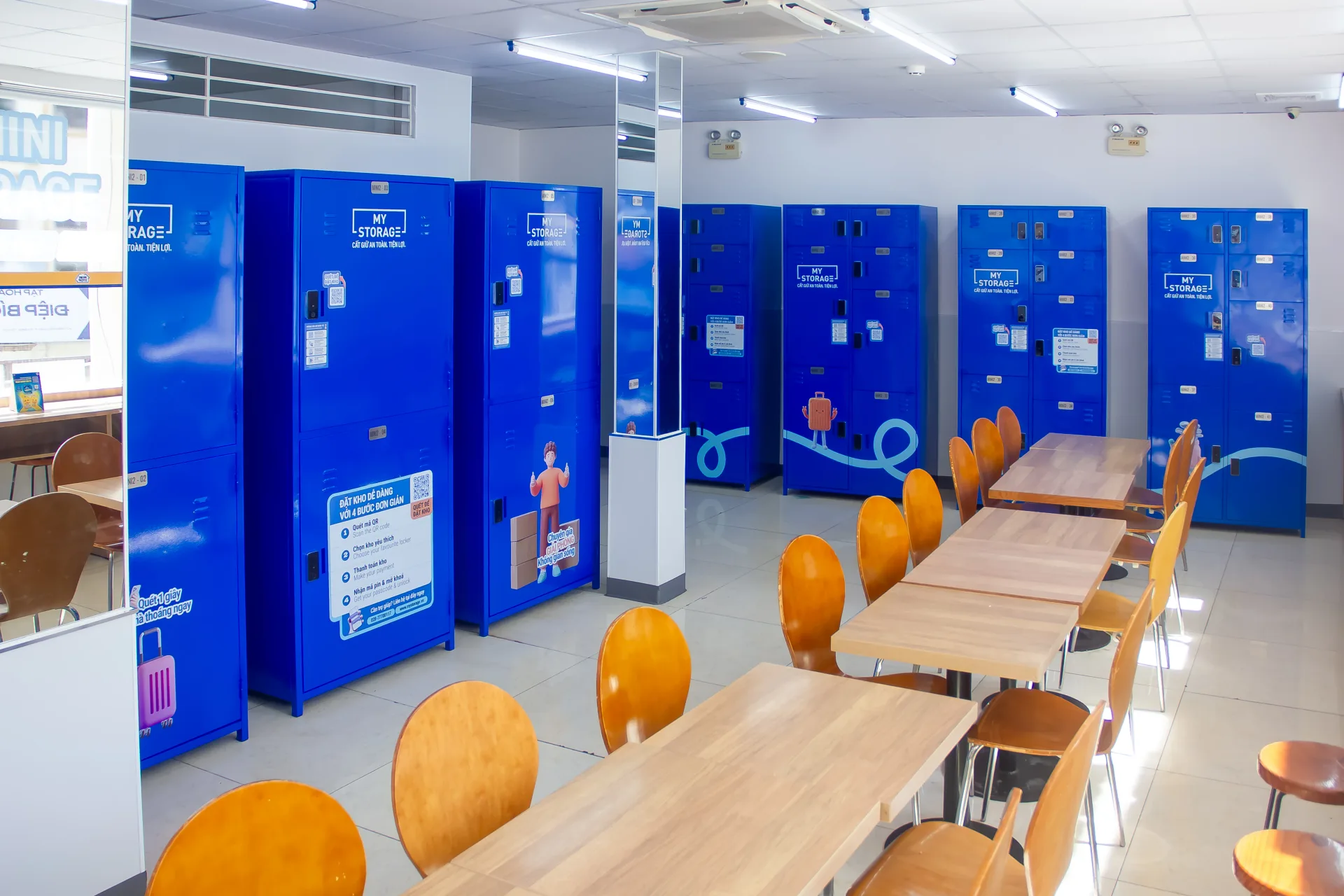The MyStorage locker area at Ministop Tran Khac Chan, with seating tables nearby