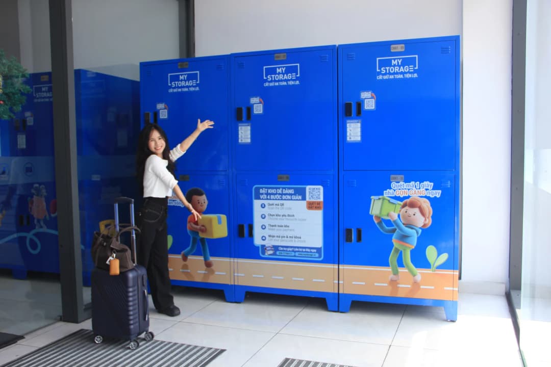 A smiling customer showcasing the MyStorage lockers at Centre Mall District 6