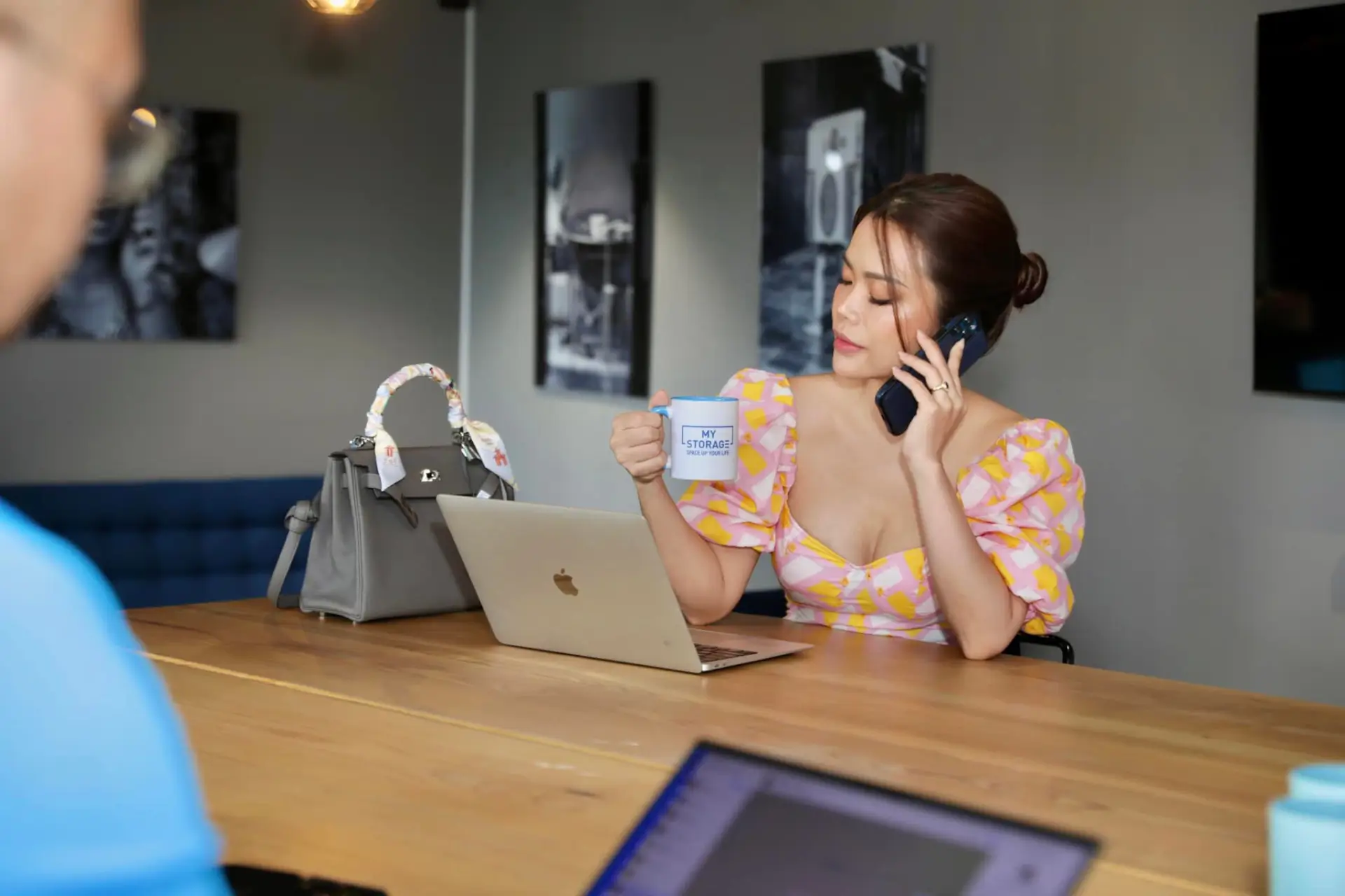 A woman on the phone arranging her MyStorage storage booking.
