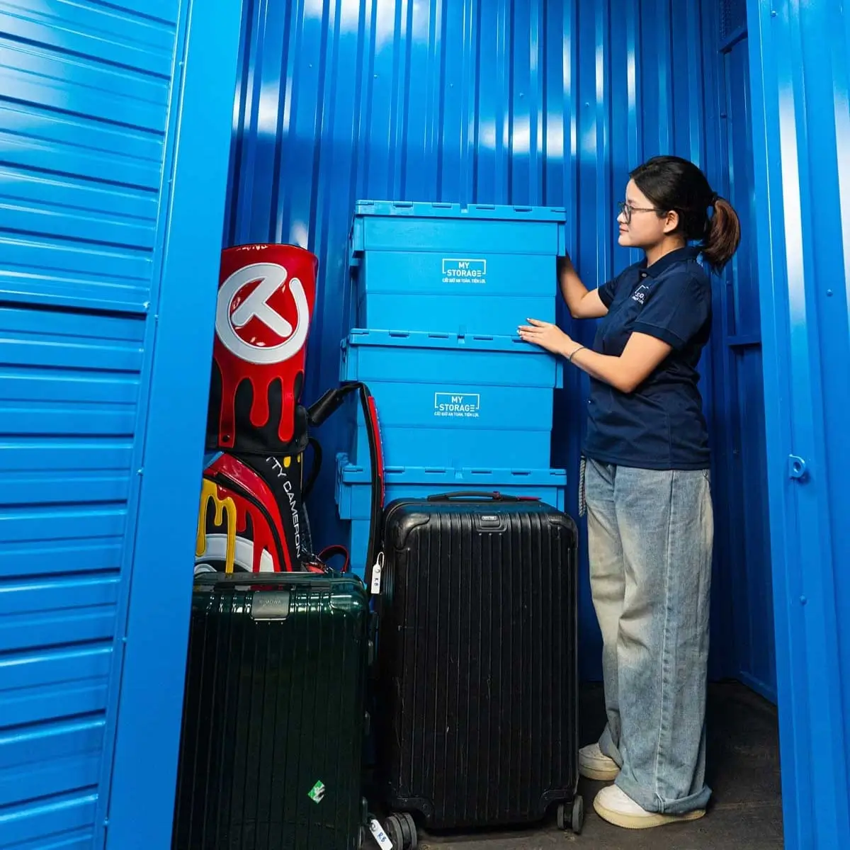 Customer with her luggage at a MyStorage self storage unit
