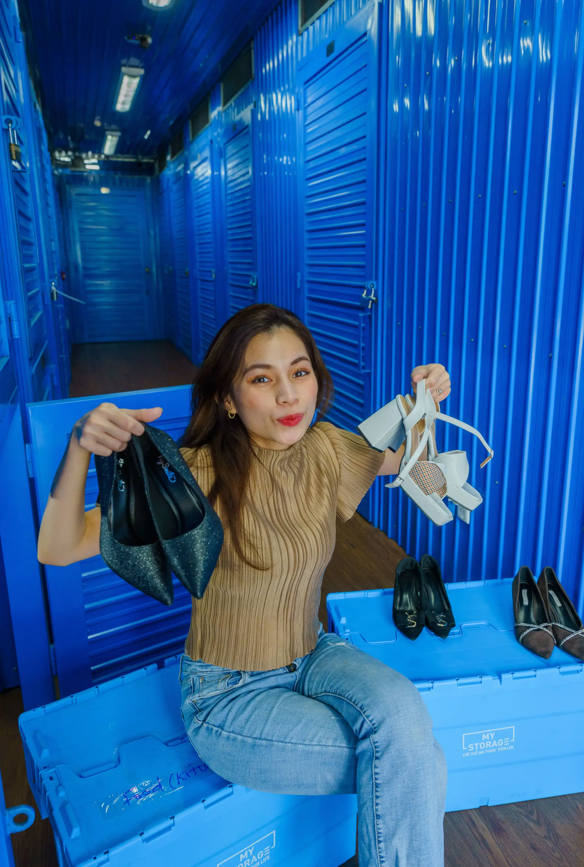 Woman holding a pair of shoes
